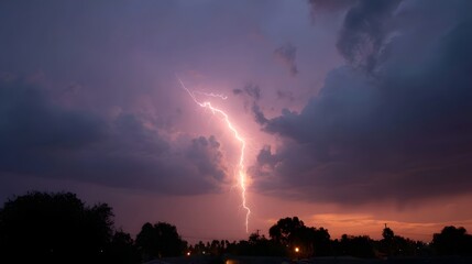A powerful lightning bolt streaks across a dramatic purple and orange twilight sky filled with storm clouds