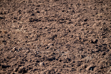 Close Up View Of Rough And Uneven Plowed Surface.