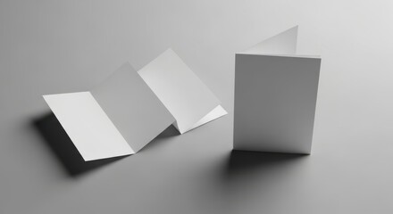 Fototapeta premium Blank brochure and unfolded paper mockup on gray background