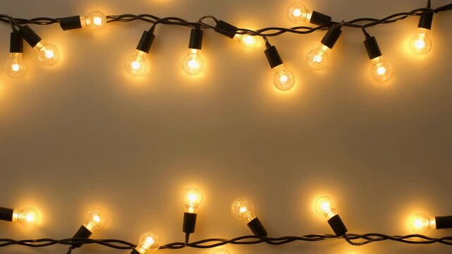 glowing LED bulb string garlands arranged as a festive border on a clean white background