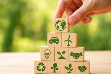 Hand placing eco-friendly wooden blocks representing sustainable energy and environmental conservation. Concept of green technology and climate action for a better future.
