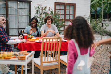 Warm family atmosphere shines through outdoor gathering, laughter, shared meals, joyful conversations, bonding moments, happiness comfort, connection and cherished memories create lasting togetherness