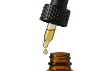 Drops of yellow liquid falling from a glass pipette into a brown bottle, clean transparent background