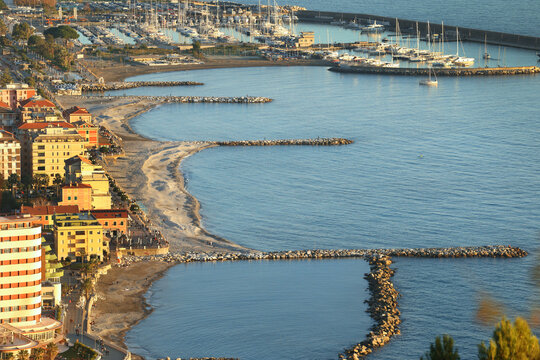 Resort town by sea. Tourism, marina, yachts and recreation, Chiavari, Italy. View from mountain on sunny day.