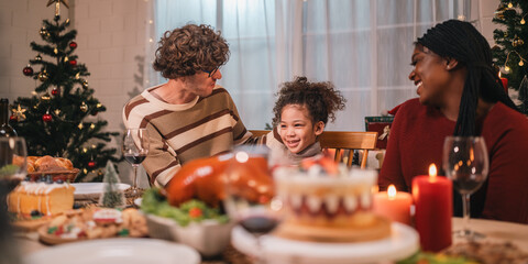 joyful family sharing a warm festive Christmas dinner creating happy memories together with laughter delicious food, spirit of love celebration togetherness around the holiday table