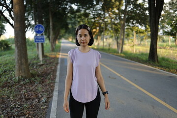 Woman exercises before running at morning.