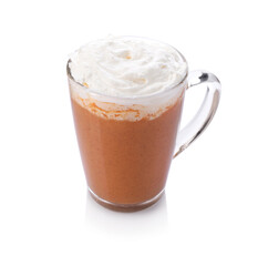 Delicious pumpkin latte with whipped cream in glass cup isolated on white