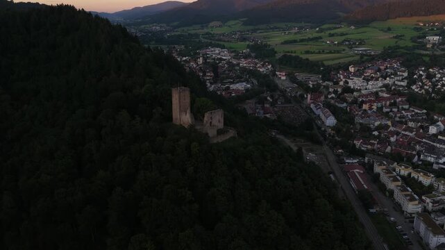 Aerial Video at Dusk of Kastelburg Castle Ruins Above Waldkirch in the German Black Forest.