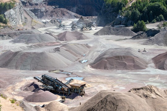 Gravel pit with sand piles and machinery