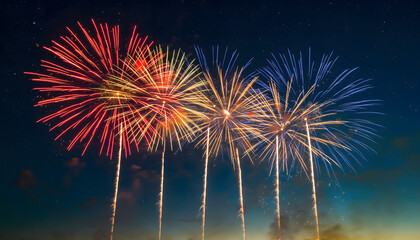 Bright and colorful fireworks display exploding in the dark night sky