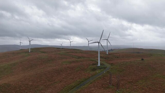 ind turbine in a Wales mountain landscape under cloudy weather