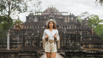 Female Traveler on Baphuon Temple Causeway, Angkor Thom, Cambodia Travel