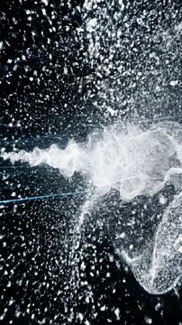 A continuous flow of millions of tiny white particles forming a dense shifting cloud against a black futuristic background density, movement, energy