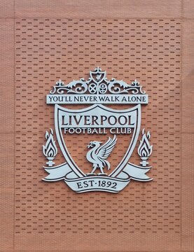 ANFIELD, LIVERPOOL, ENGLAND - JULY 15, 2025 : Liverpool football club (LFC) crest on Anfield Stadium in Liverpool. LFC has become English most successful football club in UK.