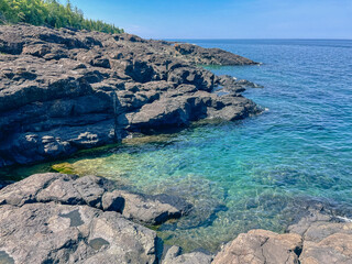 Black rocks on the scenic shore of Lake Superior in Michigan