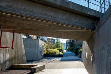 Urban architecture framed by contemporary minimalism and contrast beneath structural lines along a quiet city street in Oslo, emphasizing precise urban design