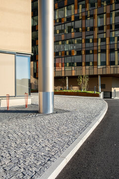 Contemporary urban architecture merging minimalism and contrast along a textured city street in Oslo, symbolizing premium urban design for a dynamic city
