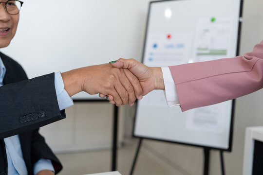 Senior businessmen calculating investment.