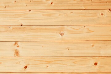 Fototapeta premium Pine wood wall light brown background. Pine boards building paneling. Natural wood background.