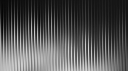 Obraz premium Monochromatic Vertical Ribbed Texture with Soft Light and Shadow Gradient abstract background