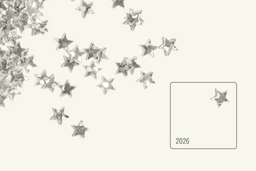 Silver star shaped sequins scattered on a light minimal background with one isolated star inside a...