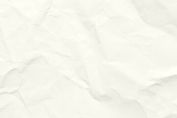Fototapeta premium Light crumpled paper texture in soft neutral tones creating a minimal background with subtle folds creases and natural surface details suitable for design craft and artistic themes. Craft