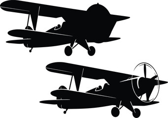 Retro biplane silhouettes flying in sky