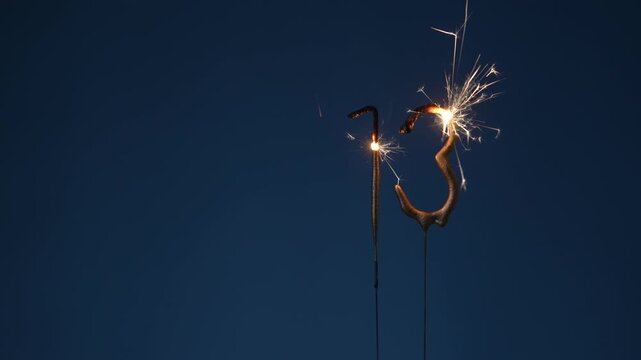 13 years celebration festive background made with Bengal fires in the form of number Thirteen.