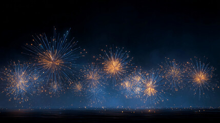 Niebiesko-złote fajerwerki na nocnym niebie – Sylwester