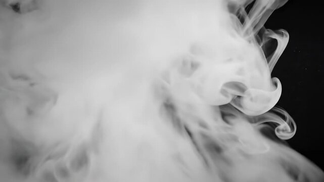 Extreme macro close-up slow motion shot of dense white vapor rapidly expanding and diffusing into the atmosphere on a clean black field chemical reaction, dispersion, diffusion