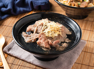 Savor tender beef slices with ginger in rich broth, a comforting Asian culinary experience, perfect for food blogs and restaurant promotions