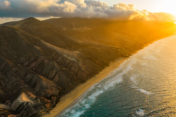 Fototapeta premium The Playa Larga is located in the southern part of the Jandía peninsula in Fuerteventura and is a wild and sprawling stretch of coastline, roughly 1.5 kilometers long