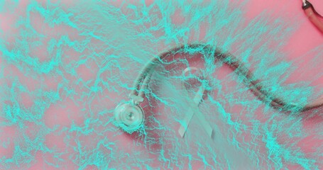 Lying metal stethoscope black tubing and pink awareness ribbon on pink backdrop, turquoise overlay