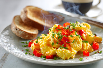Scrambled Eggs Breakfast with Toast and Fresh Vegetables
