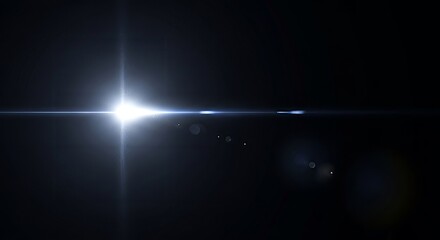 Radiant light with glowing lens flare on a stark black background illumination