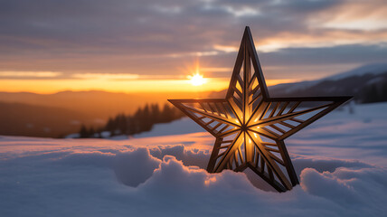 Wooden Star Decoration Illuminated in Snow at Sunset with Mountain Range and Sun Rays Christmas
