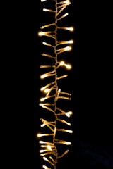 Close up of Vertical Christmas Lights glowing in the dark