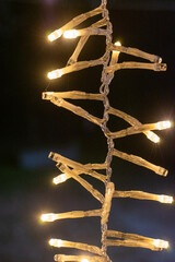 Close up of Vertical Christmas Lights glowing in the dark