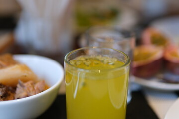 cup of teh markisa or passion fruit tea is refreshing tea, made from warm black tea mixed with passion fruit juice and then sugar is added. selected focus . High quality photo