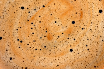 Creamy coffee surface in macro view for cafe advertising and design.