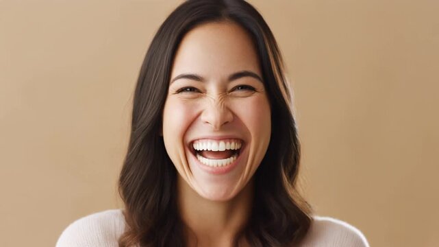A joyful person laughing, eyes sparkling with positivity and happiness, captured with soft lighting.