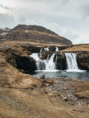Kirkjufellsfoss waterfall and Kirkjufell mountain