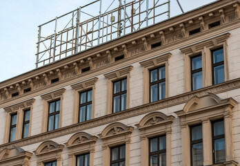 Fototapeta premium Historic facade with windows and rich decorative decoration in a classical style