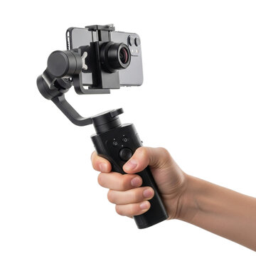 A hand holding a black gimbal stabilizer with a smartphone attached against a black background studio shot
