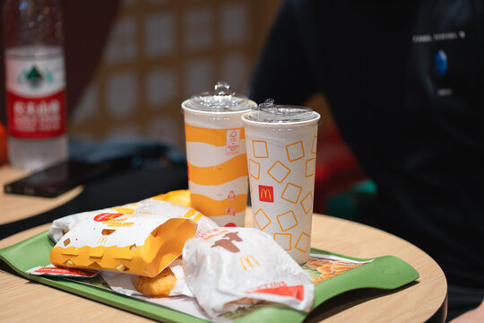 Guangzhou,China - 29 November 2025: McDonald's menu on wooden table, space for text