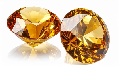 Two brilliant-cut golden-orange gemstones sparkling with precision and vibrant color on white background.