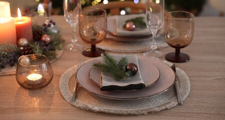 Festive table setting with Christmas decor indoors, closeup