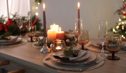 Festive table setting with Christmas decor indoors, closeup