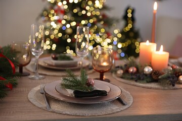 Festive table setting with Christmas decor indoors, closeup