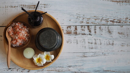 Top view Himalayan pink salt crystals on wooden board, scrub spa therapy healthy.spa relax
